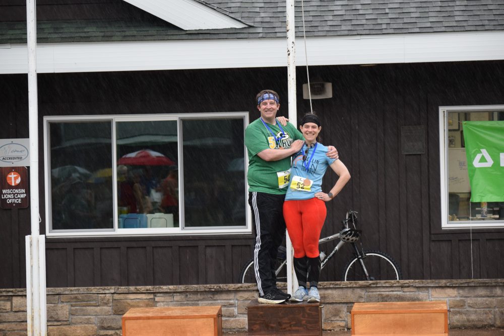 Couple with medals on the award stand